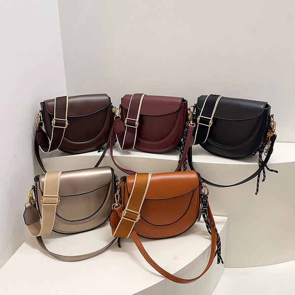Curved Saddle Crossbody Bag with Dual Interchangeable Straps     ( Charm included )