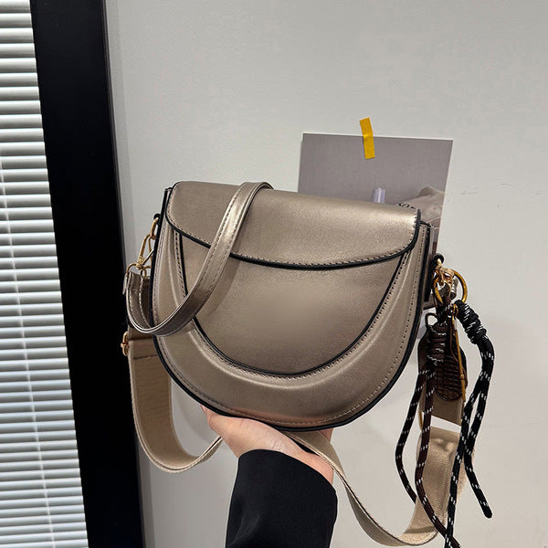 Curved Saddle Crossbody Bag with Dual Interchangeable Straps     ( Charm included )