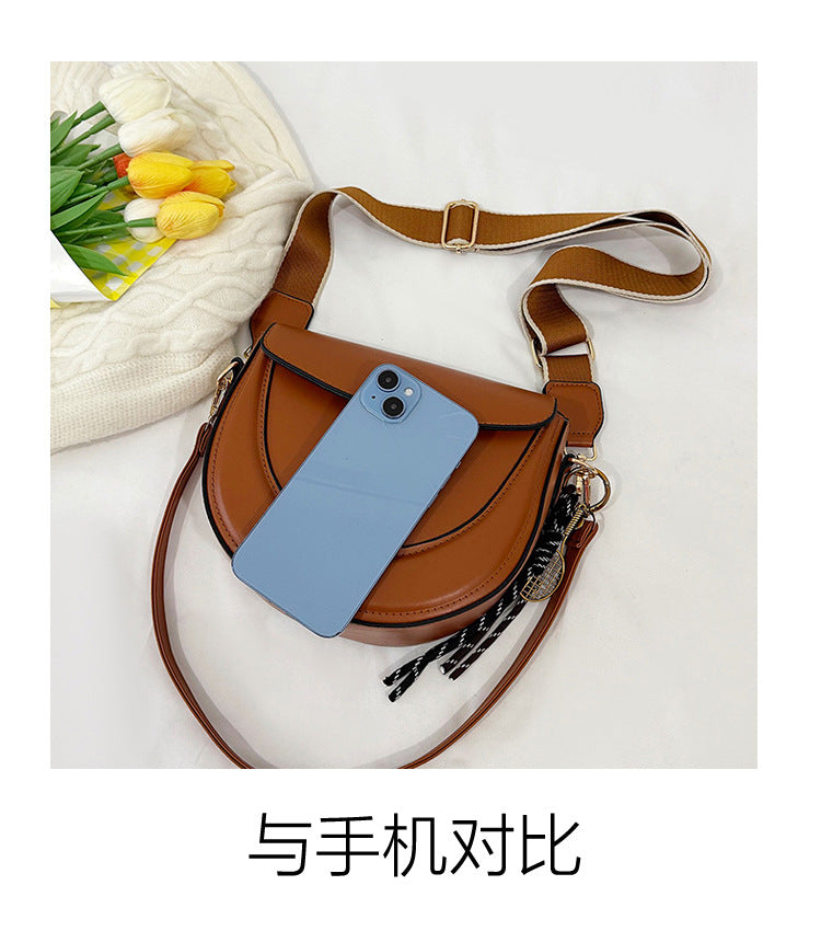 Curved Saddle Crossbody Bag with Dual Interchangeable Straps     ( Charm included )