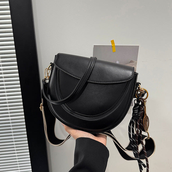 Curved Saddle Crossbody Bag with Dual Interchangeable Straps     ( Charm included )