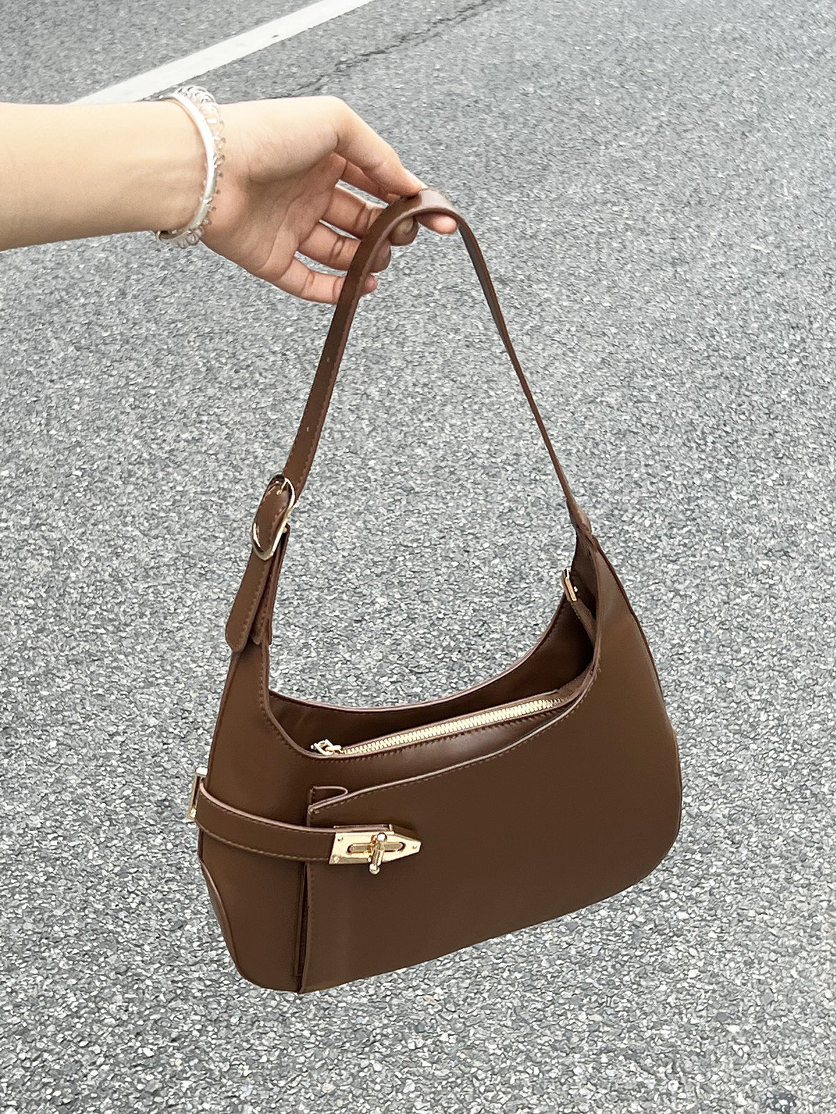 Minimalist Crescent Shoulder Bag with Buckle Accent and Adjustable Strap
