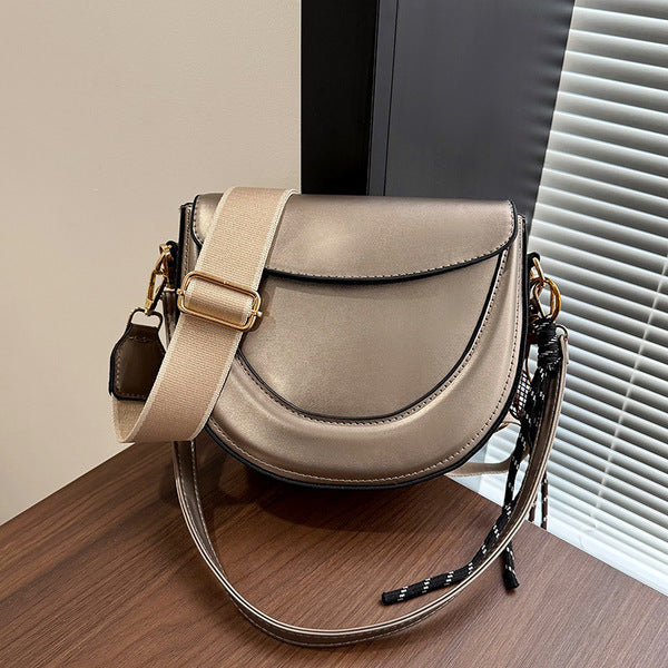 Curved Saddle Crossbody Bag with Dual Interchangeable Straps     ( Charm included )
