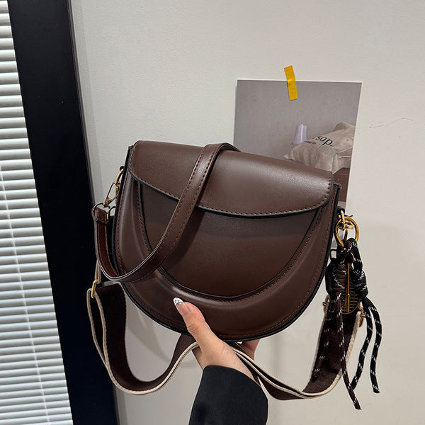 Curved Saddle Crossbody Bag with Dual Interchangeable Straps     ( Charm included )