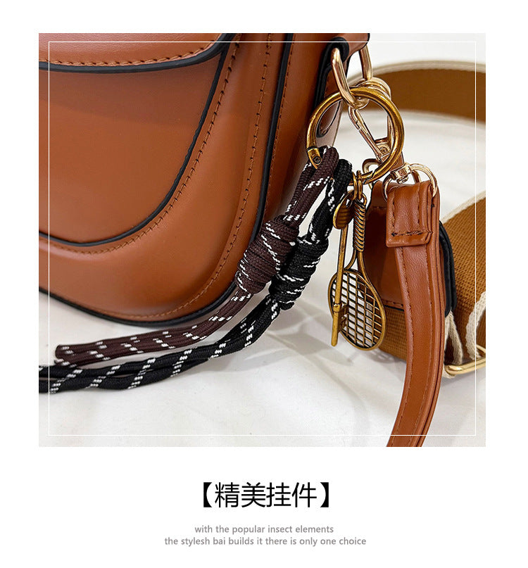 Curved Saddle Crossbody Bag with Dual Interchangeable Straps     ( Charm included )