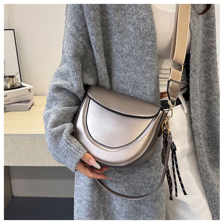 Curved Saddle Crossbody Bag with Dual Interchangeable Straps     ( Charm included )