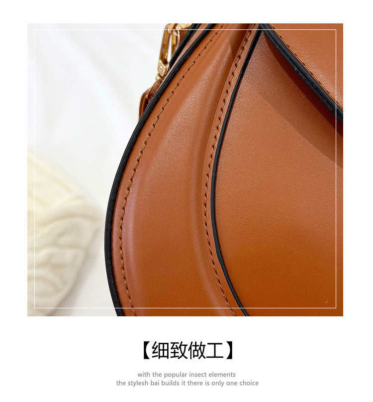Curved Saddle Crossbody Bag with Dual Interchangeable Straps     ( Charm included )