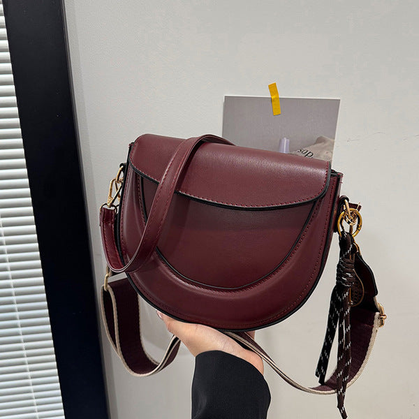 Curved Saddle Crossbody Bag with Dual Interchangeable Straps     ( Charm included )