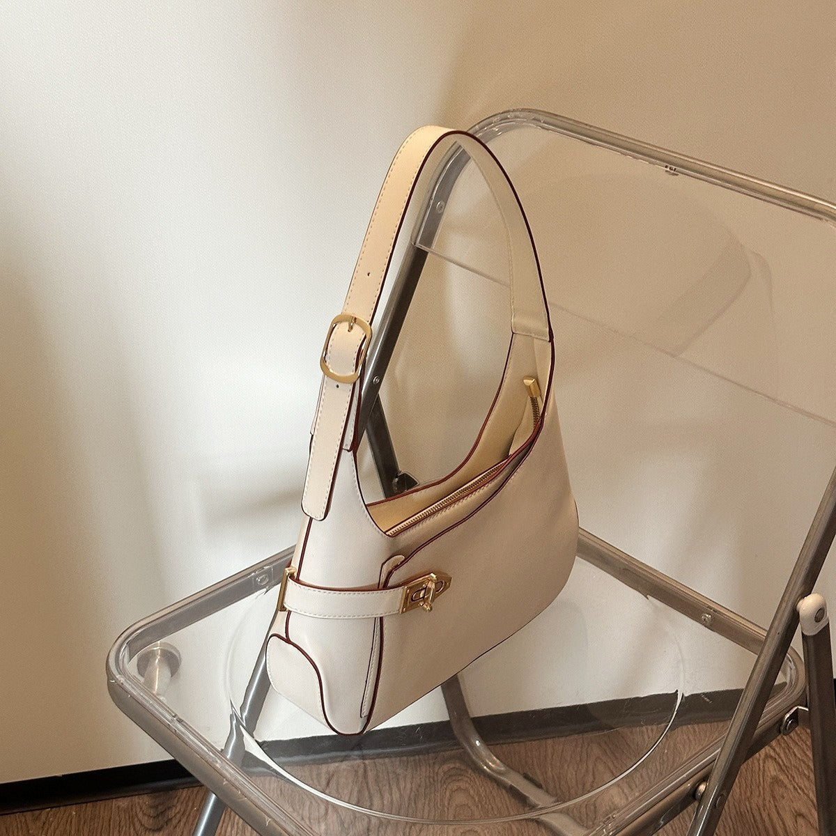 Minimalist Crescent Shoulder Bag with Buckle Accent and Adjustable Strap