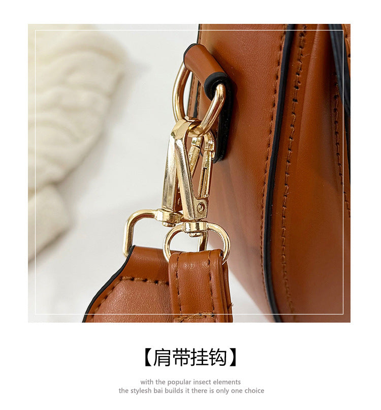 Curved Saddle Crossbody Bag with Dual Interchangeable Straps     ( Charm included )